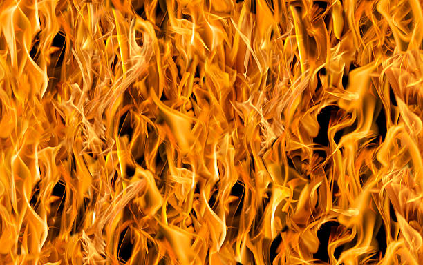 istock yellow on black fire sparks seamless background 503869706