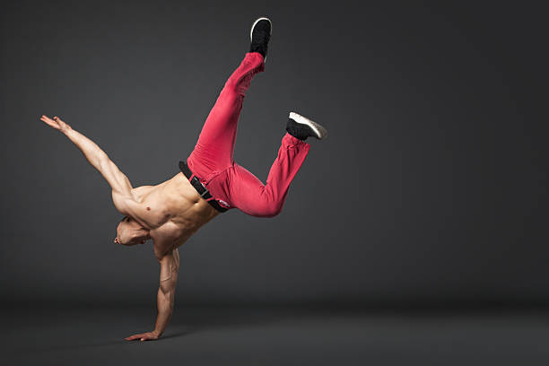 istock Young male professional dancer B-boying on gray background. 503869734