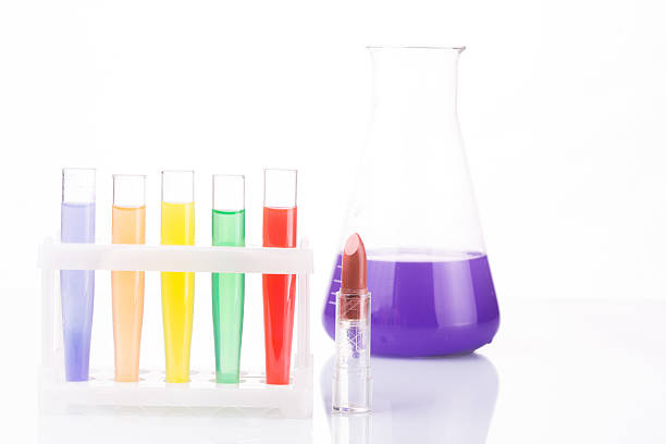 istock chemical test tubes and lipstick. harmful cosmetics 503870738