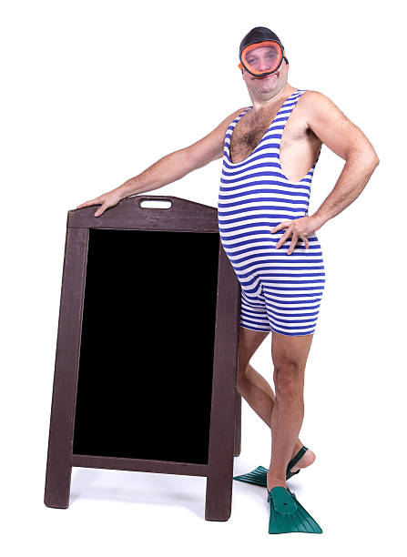 istock Man in swimsuit standing beside menu 503873760