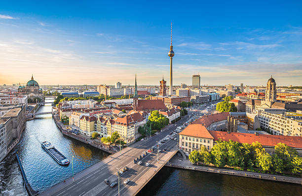 Berlin skyline with Spree river at sunset, Germany Aerial view of Berlin skyline with famous TV tower and Spree river in beautiful evening light at sunset, Germany. european culture stock pictures, royalty-free photos & images