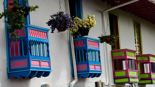 istock Colorful blue and red house front with flowers on balcony 503874964