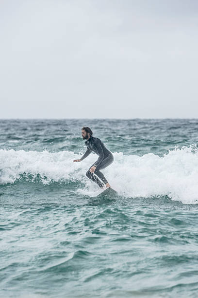 istock Action shot of man surfing on wave 503889010