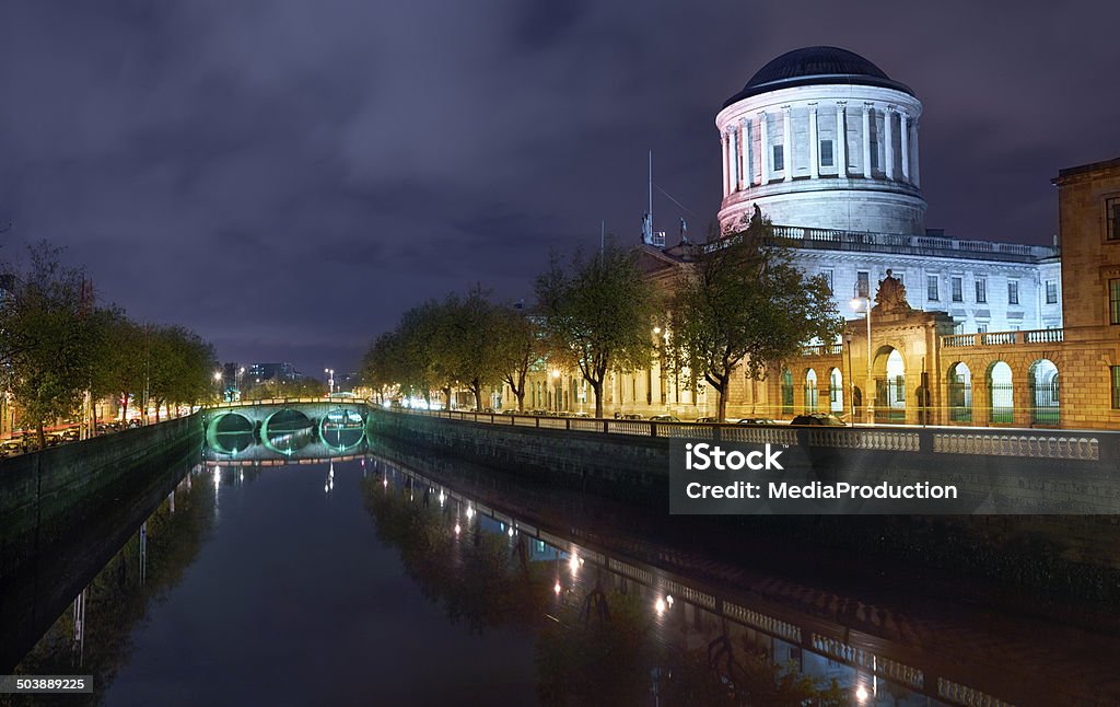 Dublin river liffey and court house illuminater at night Four Courts Stock Photo