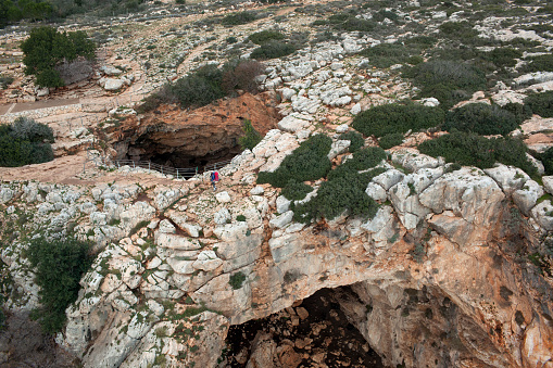 Backpacker woman standing on Rainbow cave (Keshet Cave, Galilee, North of Israel).