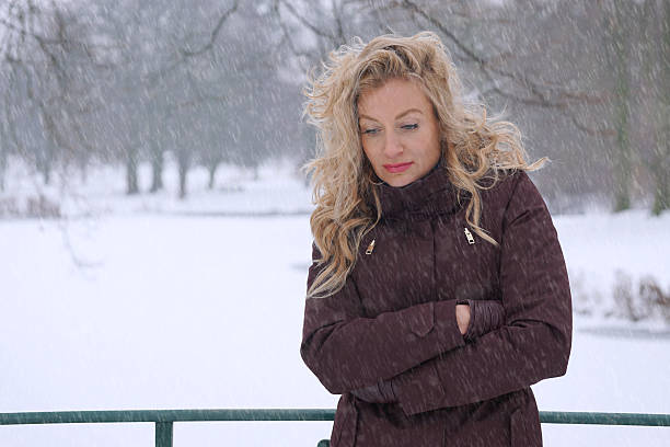 Portrait close up of beautiful young blonde woman outdoors