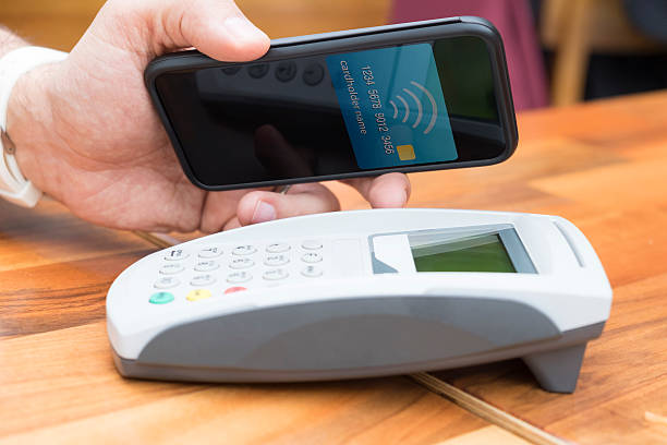 istock Man Paying With NFC Technology On Smart Phone 503890914
