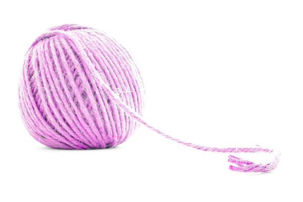 istock Pink traditional skein, crochet yarn roll isolated on white background 503890974