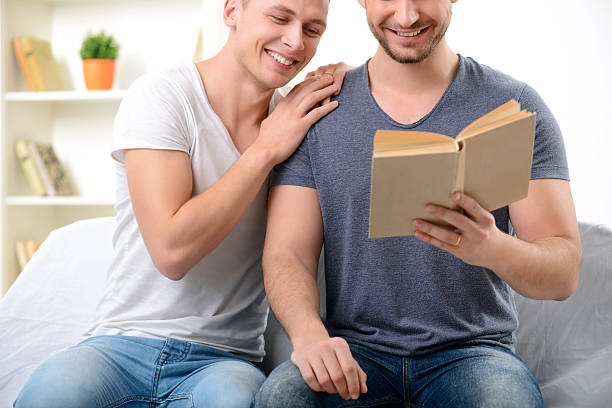 istock Loving homosexuals sitting on the sofa 503891046