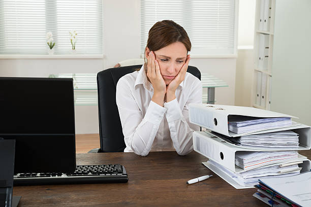 istock Young Businesswoman Looking At Folders 503891208