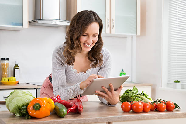 istock Woman With Digital Tablet And Vegetables 503892080