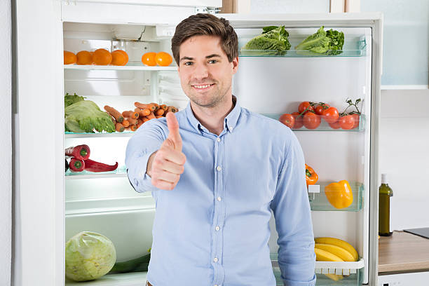 istock Man Standing In Front Of Open Fridge 503894068