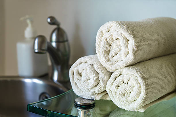 istock White towels heap on shelf in bathroom 503894252