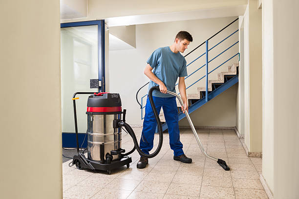 istock Male Worker Cleaning With Vacuum Cleaner 503896866