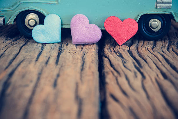 istock Hearts with vintage blue van background on old wood table 503899828