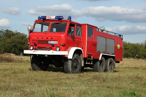 Wodynie, Poland - September 3rd, 2011: Star 266 firetruck stopped on the grass.This 6x6 vehicle is dedicated to use on the bad roads. The 266 model was one of the most popular firetrucks in Poland.