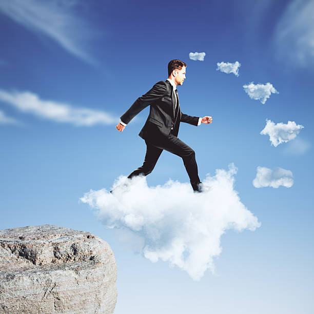 istock Businessman climbing on cloud stairway concept 503900192