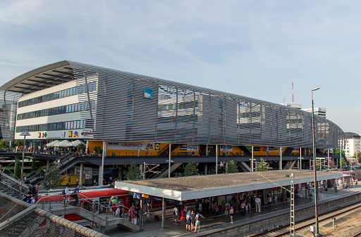 Munich, Germany - July 3, 2015: View from the Hackerbrueck on the station platform, where trains arrive and depart, in the background is the building of the central bus station in Munich