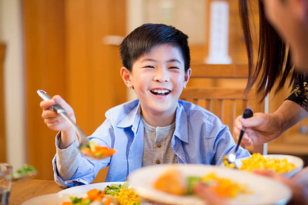 istock Young boy enjoying lunch 503911912