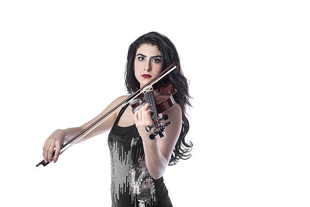 istock Young beautiful woman playing the violin over white background 503912868