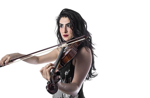 istock Young beautiful woman playing the violin over white background 503913182