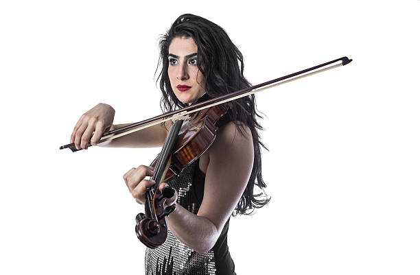 istock Young beautiful woman playing the violin over white background 503913204