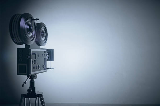 istock Old style film camera at grey wall backgound 503913618
