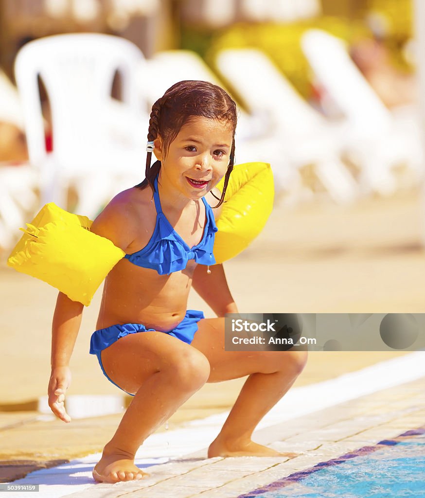 Little Girl Preparing To Jump Into Water Stock Photo - Download ...