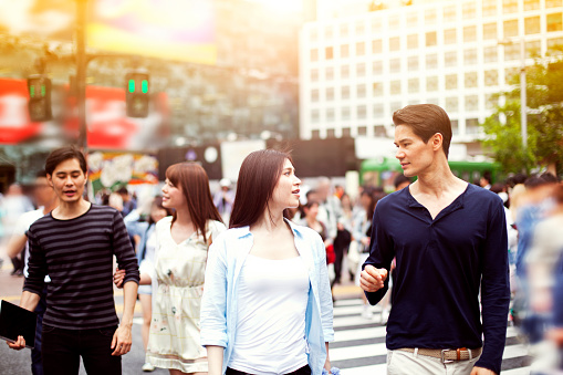 Group of happy young japanese people fun outdoors, Tokyo. Young people walking in Shibuya. All people in the image are worn with casual clothes. Concept for urban lifestyle and friendship. Image is taken during Tokyo Istockalypse 2015