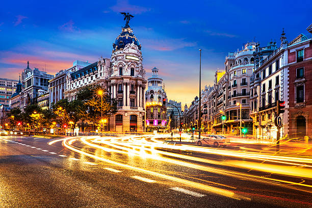 Madrid city center, Gran Vis Spain Rays of traffic lights on Gran via street, main shopping street in Madrid at night. Spain, Europe. madrid city view stock pictures, royalty-free photos & images