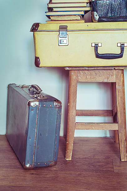istock Vintage Composition with old books, suitcases and stool. 503914972