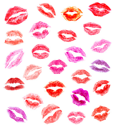 Many different lipstick kisses isolated on a white background.