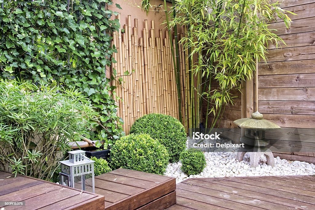 Japanese garden with bamboos and stone lantern Japanese Garden Stock Photo