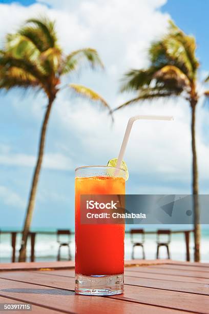 Drink On The Beach Stock Photo - Download Image Now - Table, Tequila Sunrise, Alcohol - Drink
