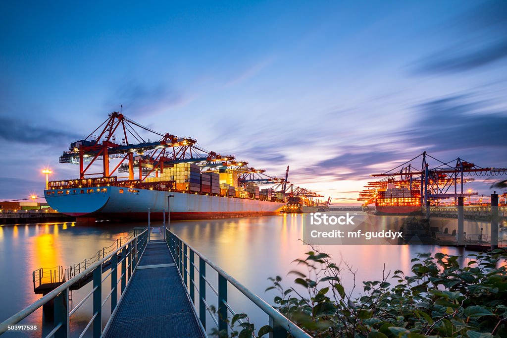 Container Terminal Hamburg Cargo terminal on a nice evening. Freight Transportation Stock Photo