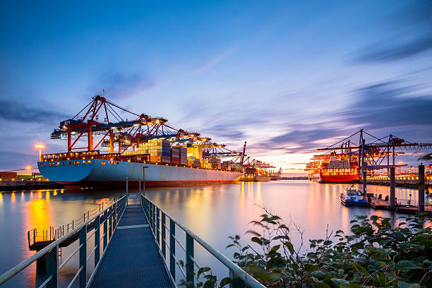 Container Terminal Hamburg Cargo terminal on a nice evening. hamburg germany photos stock pictures, royalty-free photos & images
