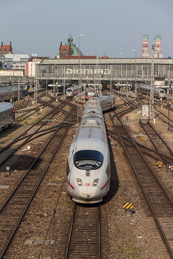 Munich, Germany - July 3, 2015: Central railway station in Munich with leaving ICE train, picture was taken from the Hackerbruecke