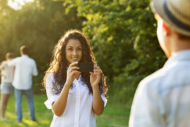 istock woman taking photo with cellphone 503919397