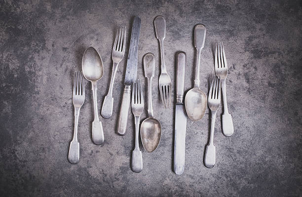 istock Vintage silverware on grunge background top view 503920566