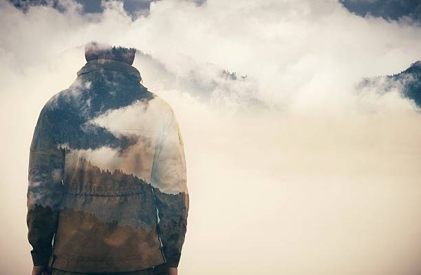 Double Exposure of Man and Cloudy Mountains Double Exposure of Man and Cloudy Mountains forest Travel Lifestyle conceptual background male meaning stock pictures, royalty-free photos & images