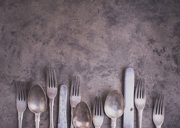 istock Vintage silverware from bottom side of grunge background 503923144