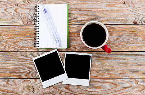 istock Workspace with coffee cup, instant photos, note paper and notebo 503925948