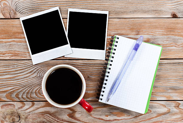 istock Workspace with coffee cup, instant photos, note paper and notebo 503925996