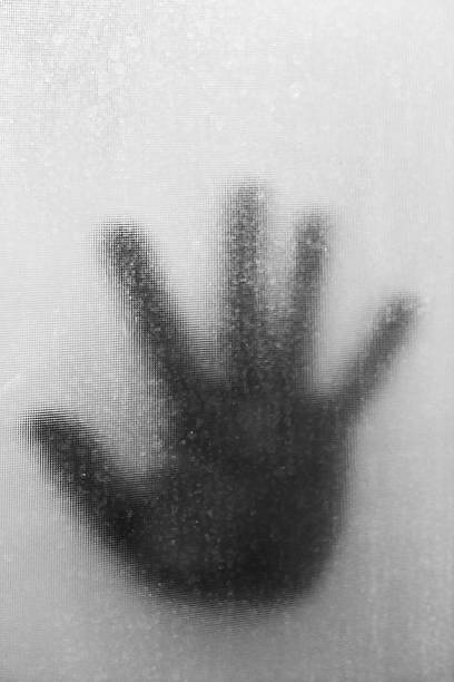istock Sillouette Hand Behind Stain Glass 503942507