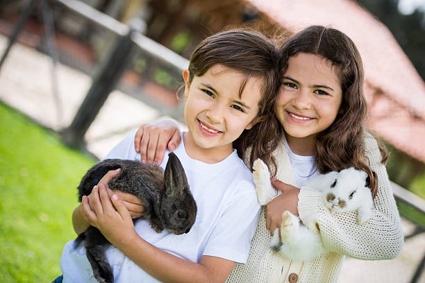 istock Happy kids with bunnies 503943355