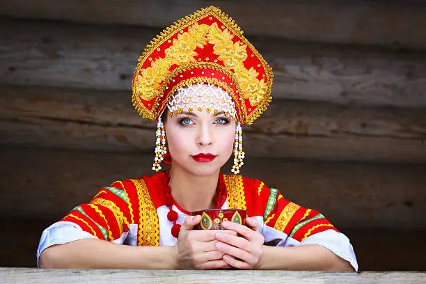 Russian girl drinking tea in the village