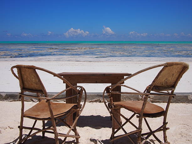 istock Empty chairs on tropical Indian Ocean beach 503948326