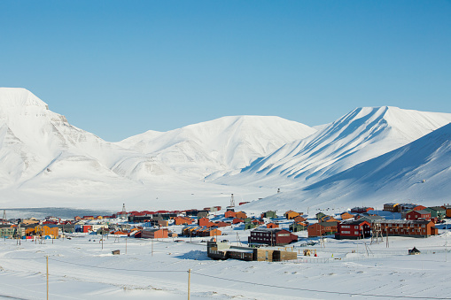 Longyearbyen, Spitsbergen, Norway - 03 APRIL, 2015: Small town Longyearbyen among snow-capped mountains of the Norwegian archipelago of Svalbard.