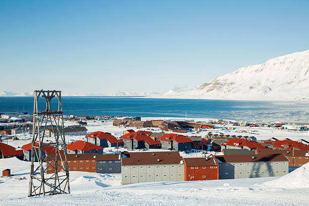 istock Small town among snow-capped mountains 503948632