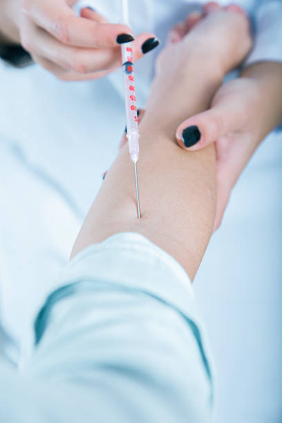 istock Doctor giving an injection to a patient..toned image 503948926